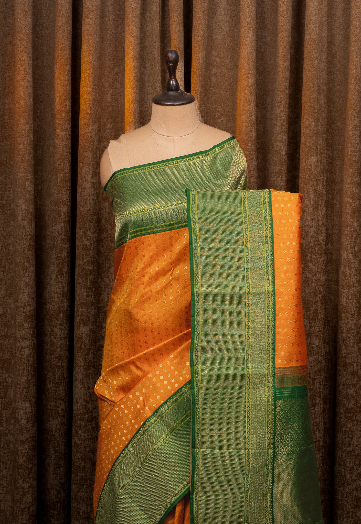 Orange and Green Lakshadeepam Turning Border Pure Kanchipuram Silk Saree