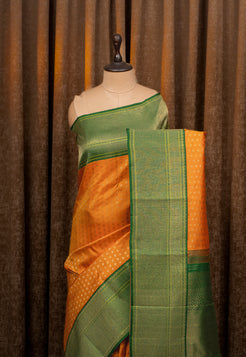 Orange and Green Lakshadeepam Turning Border Pure Kanchipuram Silk Saree
