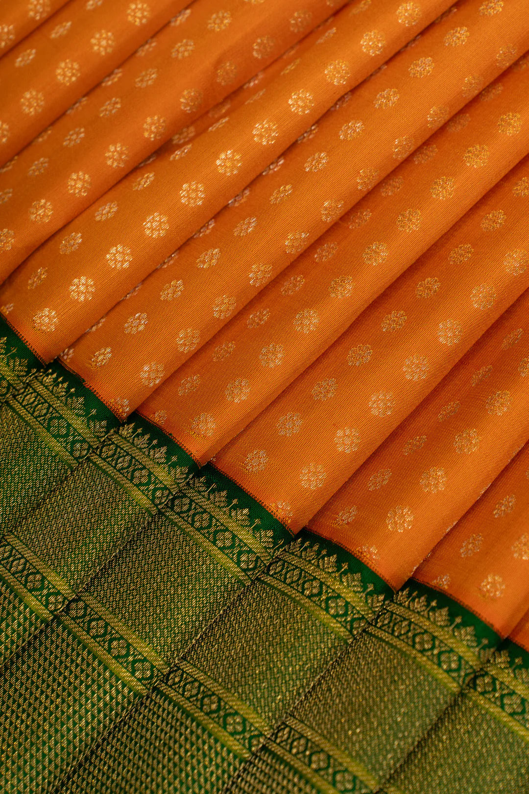 Orange and Green Lakshadeepam Turning Border Pure Kanchipuram Silk Saree